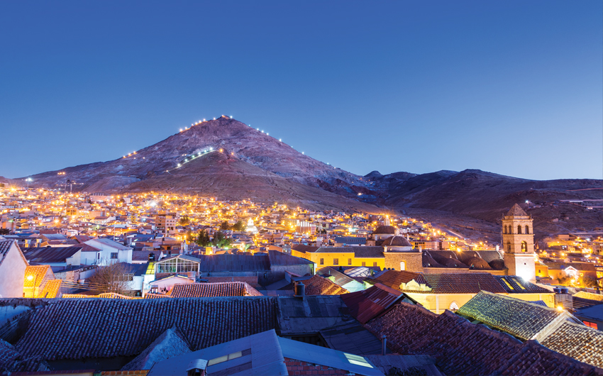 Historic center of Potosi, Bolivia at night with Cerro Rico in the background